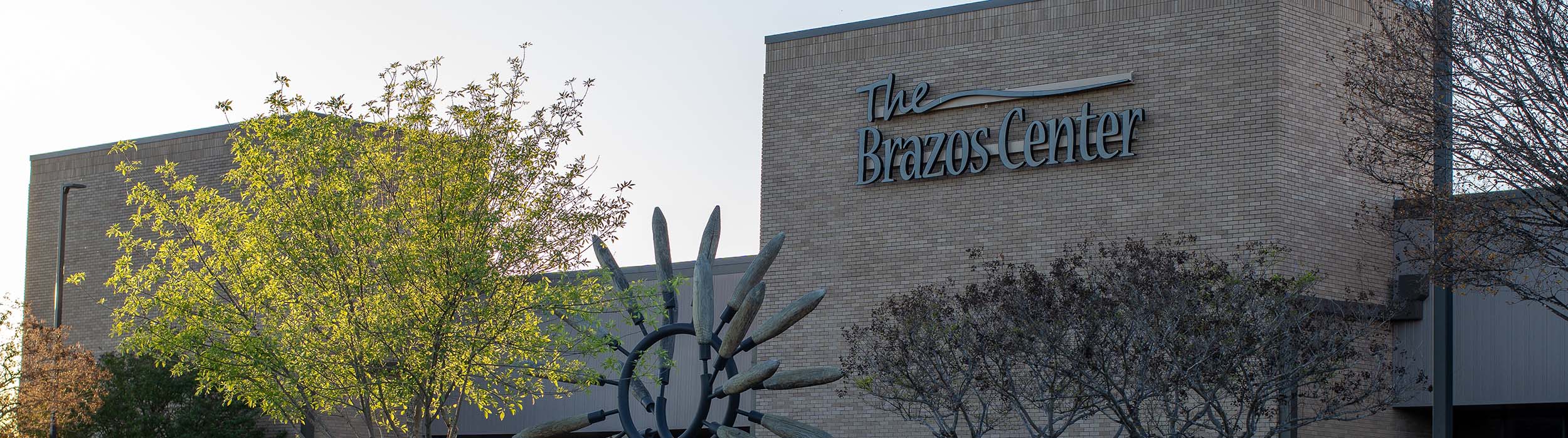 Exterior photo of the Brazos Center as the sun sets.