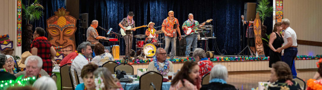 A senior event at the Brazos Center with band on stage.